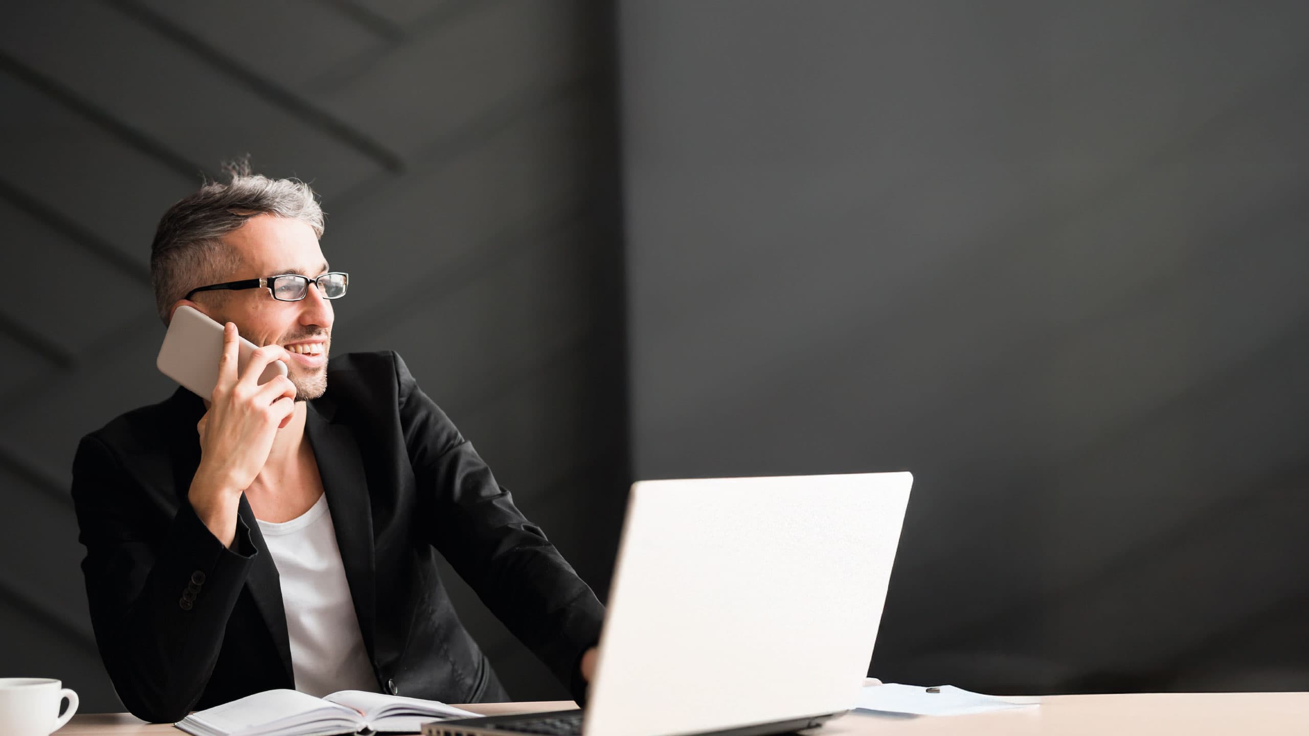 Professional on phone in modern office